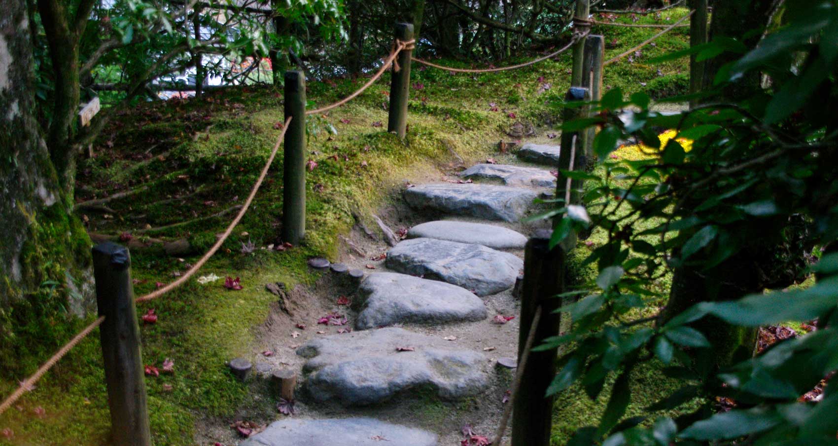 Large smooth stones placed on beaten earth – Shoyoen Gardens