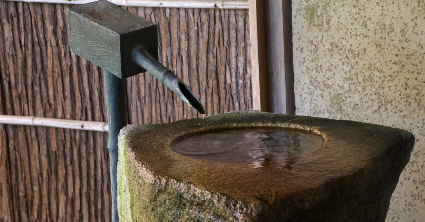 A tall stone water basin, Yoshikien Garden Nara