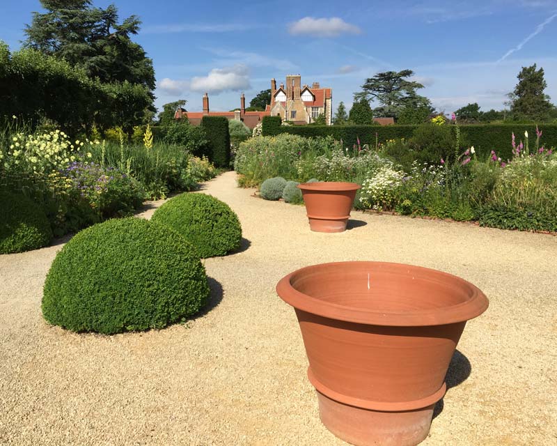 Loseley Park- gravel paths lead through the Herb Garden to the Rose Garden